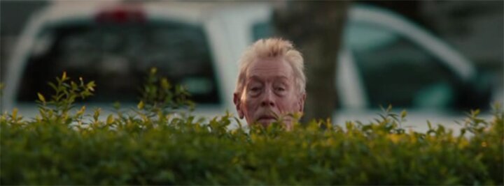 Max von Sydow looking over a hedge Max von Sydow looking over a hedge